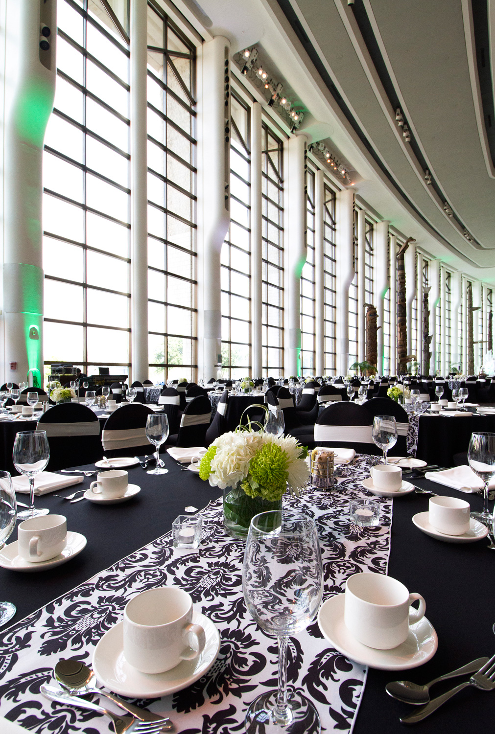 Tables set with black and white damask tablecloth.