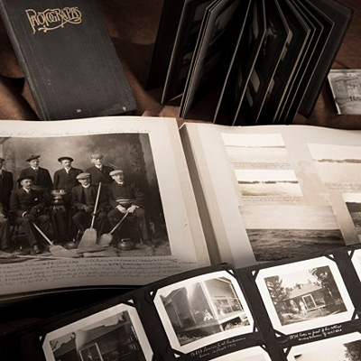 A collection of old photos and books on a table at the Canadian Museum of History in Ottawa.