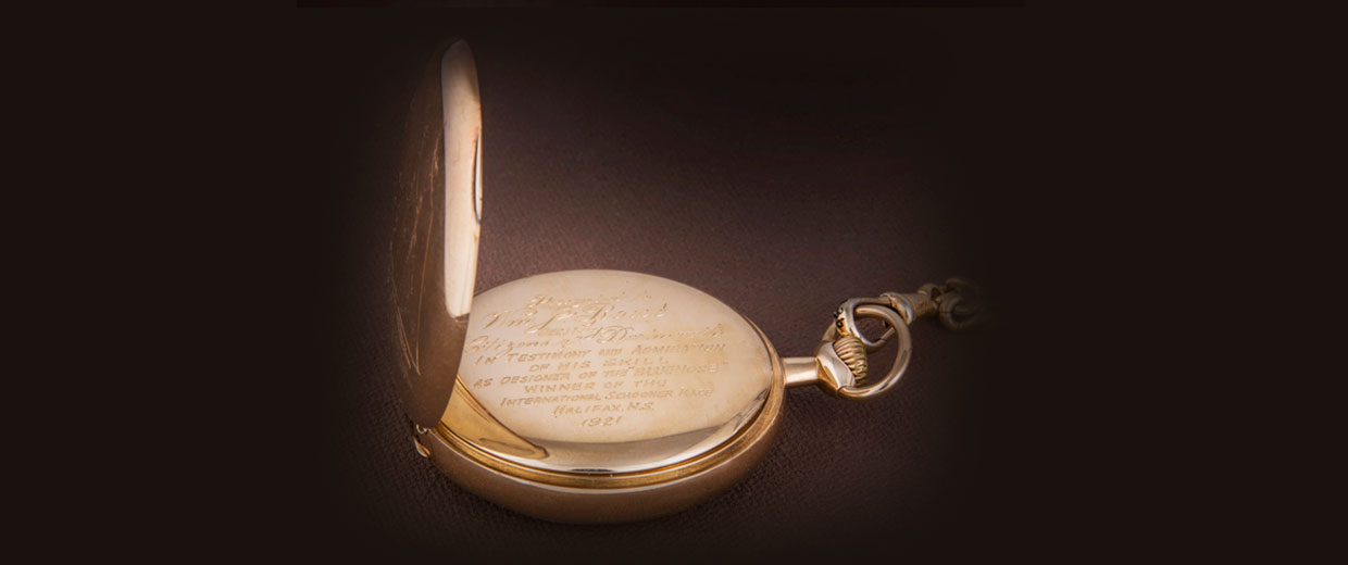 A gold pocket watch with a quote on it, displayed at the Canadian Museum of History in Ottawa.